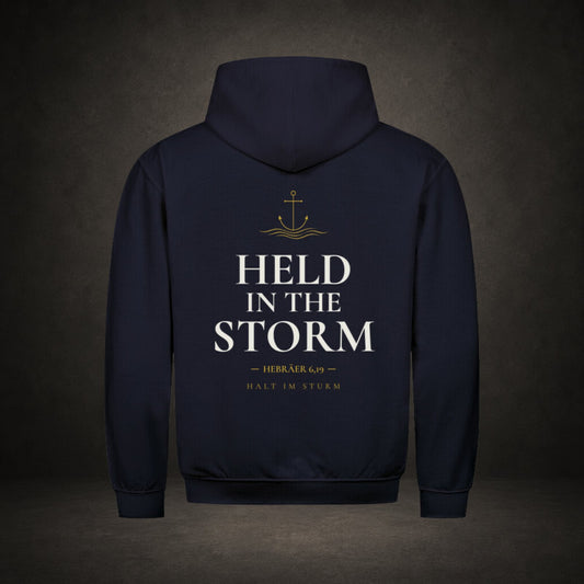Held in the Storm – großer Rückenprint mit goldenem Anker und Schriftzug auf navy färbenden Premium-Hoodie, Hebräer 6,19, Anchor-Serie von Bulletproof Faith